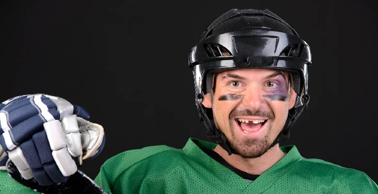 hockey player with tooth knocked out